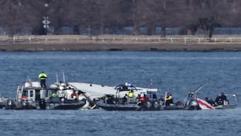 Emergency workers recover debris from the Potomac River in the aftermath of the collision of American Airlines flight 5342 and a Black Hawk helicopter, as seen from Virginia. Reuters