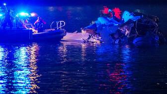 Emergency response teams including Washington, DC Fire and EMS, DC Police and others, assess airplane wreckage in the Potomac River near Ronald Reagan Washington Airport in Arlington, Virginia. An American Airlines flight from Wichita, Kansas collided with a helicopter while approaching Ronald Reagan National Airport.  AFP