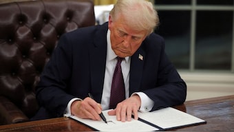 US President Donald Trump signs documents as he issues executive orders and pardons in the Oval Office at the White House. Among the many executive orders he has passed, Trump has issued one titled, Ending radical and wasteful government DEI programs and preferencing. Reuters