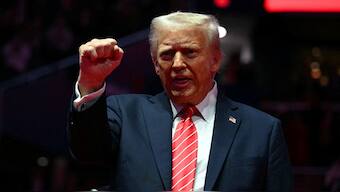 US President-elect Donald Trump raises his fist during a MAGA victory rally at Capital One Arena in Washington, DC, one day ahead of his inauguration ceremony. AFP