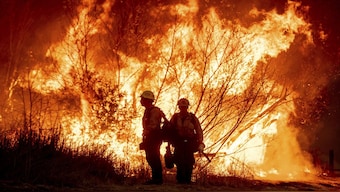 Fire crews battle the Kenneth Fire in the West Hills section of Los Angeles on Thursday, January 9. AP