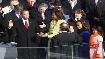 Barack Obama, takes the oath given by US. Supreme Chief Justice John Roberts, Jr (lower right) during the inauguration ceremony in Washington on January 20, 2009. Daughters Malia and Sasha look on, as Michelle Obama holds the Bible used by President Abraham Lincoln at his inauguration in 1861.  File image/Reuters