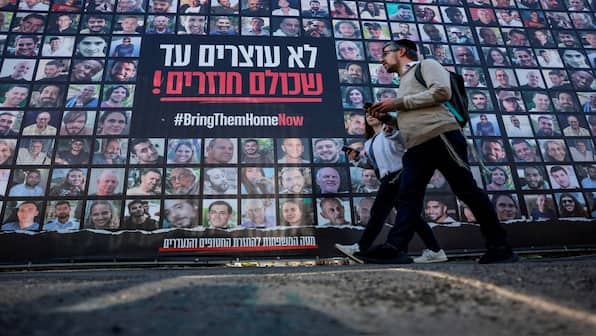 Ceasefire goes into effect after Hamas releases names of three hostages. Who are they?