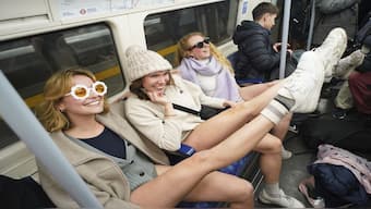 People on board the Tube as they take part in the annual event "No Trousers Tube Ride" in London, on Sunday. AP
