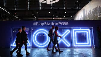 Cosplayers dressed as Spider-Man walk in front of the PlayStation stand at the Paris Games Week (PGW), a trade fair for video games in Paris, France, November 5, 2023. File Image/Reuters