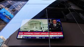 A screen shows news concerning the US Supreme Court's decision to uphold a TikTok ban law, at the Nasdaq MarketSite in New York City om January 17. Reuters