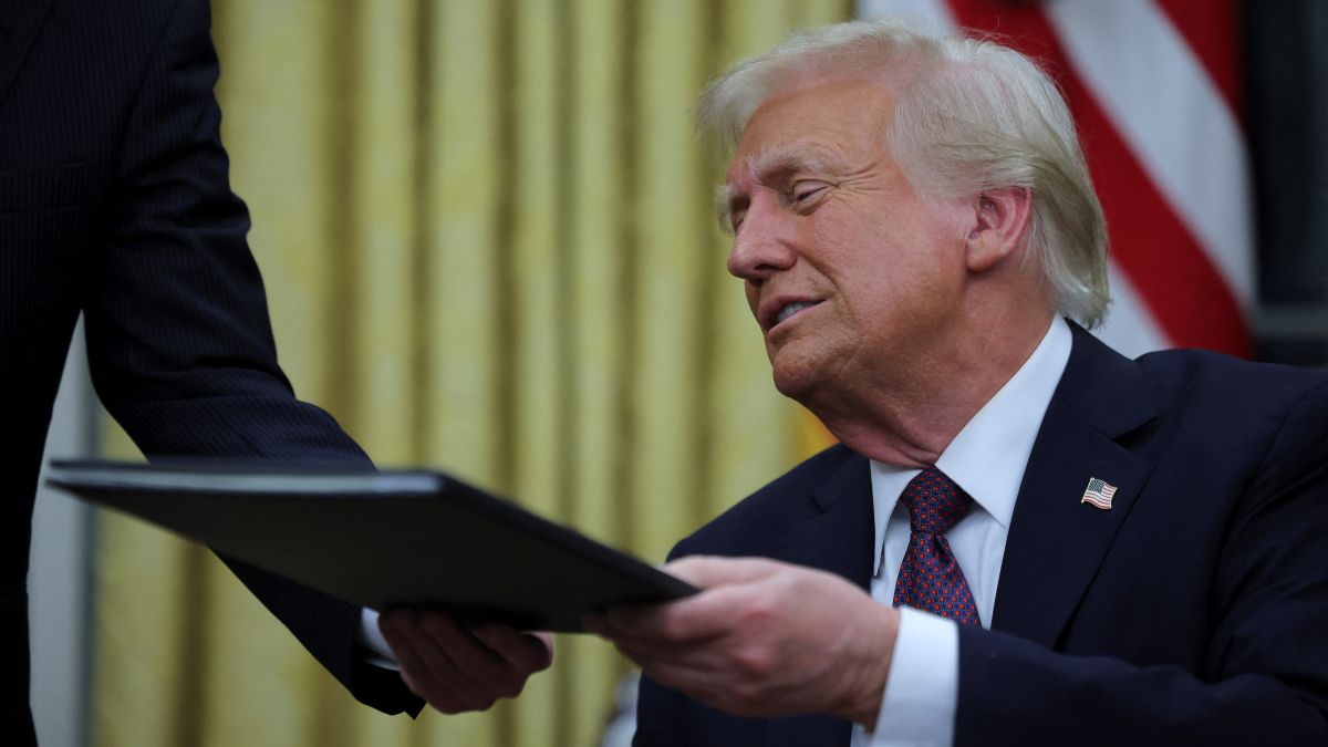 US President Donald Trump reacts on the day he signs documents as he issues executive orders and pardons for January 6 defendants in the Oval Office at the White House on Inauguration Day in Washington. Reuters US President Donald Trump reacts on the day he signs documents as he issues executive orders and pardons for January 6 defendants in the Oval Office at the White House on Inauguration Day in Washington. Reuters