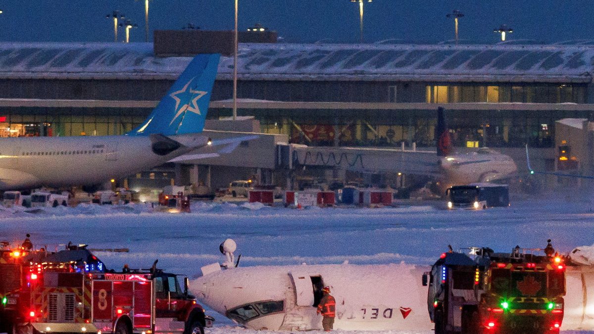 Emergency responders operate around a plane on a runway after a plane crash at Toronto Pearson International Airport in Mississauga, Ontario, Canada. Reuters Emergency responders operate around a plane on a runway after a plane crash at Toronto Pearson International Airport in Mississauga, Ontario, Canada. Reuters