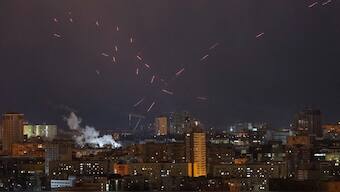 Tracers are seen in the night sky as Ukrainian servicemen fire at the drone during a Russian drone strike, amid Russia's attack on Ukraine, in Kyiv, Ukraine. File image/ Reuters