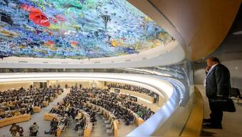 A diplomat observes the room at the opening of the 57th session of the Human Rights Council in Geneva on September 9, 2024. AFP