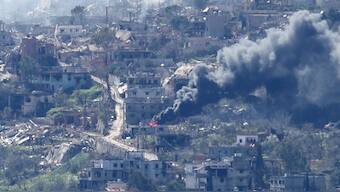 A photo taken from the southern Lebanese area of Marjayoun, shows smoke rising from buildings in the southern Lebanese village of Kfar Kila during an Israeli army operation in the village. AFP