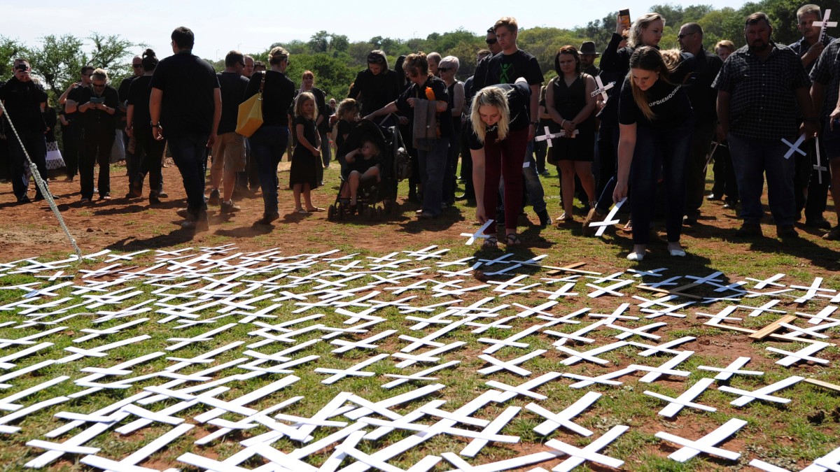 People place white crosses representing farmers killed in the country at a ceremony at the Vorrtrekker Monument in Pretoria, South Africa, October 30, 2017. AP People place white crosses representing farmers killed in the country at a ceremony at the Vorrtrekker Monument in Pretoria, South Africa, October 30, 2017. AP