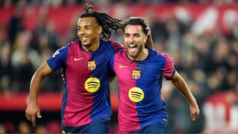 Barcelona kept up with Real Madrid and Atletico Madrid in the La Liga title race with a win over Sevilla. AP 