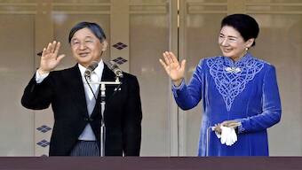 Japanese Emperor Naruhito, left, accompanied by Empress Masako, right, waves to well-wishers from the balcony of the Imperial Palace in Tokyo on his 65th birthday, Sunday, Feb. 23, 2025. AP