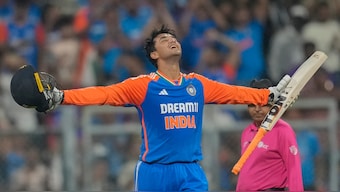 India opener Abhishek Sharma celebrates after completing his century in 37 balls during the fifth T20 against England in Mumbai. AP