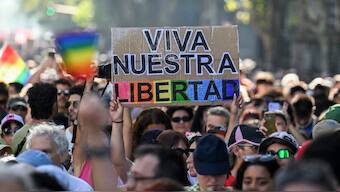 A demonstrator holds a sign that reads in spanish 'Long live our freedom' during a national march called by women and LGBTQ pride groups in repudiation of President Javier Milei's remarks in Davos on feminism and the LGBT community, in Buenos Aires. AFP