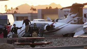 Scottsdale Fire Department firefighters work on a crashed Learjet at Scottsdale Airport after it crashed into another parked plane Monday, Feb. 10, 2025, in Scottsdale, Ariz. AP
