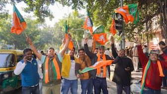 BJP supporters celebrate the party's lead during counting of votes for Delhi Assembly polls, in New Delhi on February 8, 2025. PTI