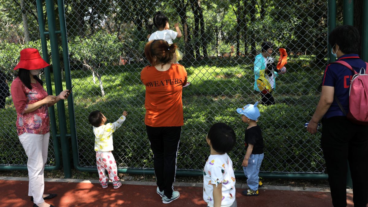 Children play next to adults at a park in Beijing, China. File image/ Reuters Children play next to adults at a park in Beijing, China. File image/ Reuters