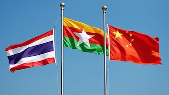 From L-R, flags of Thailand, Myanmar and China are pictured here. The three countries are linked due to scam networks affecting their territory or citizens. AI generated image via DALL-E