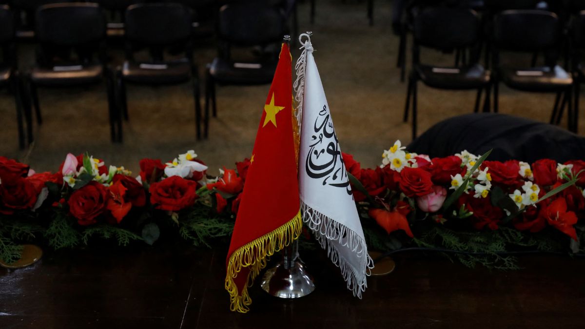The flags of the China and the Islamic Emirate of Afghanistan are displayed during a news conference. Reuters The flags of the China and the Islamic Emirate of Afghanistan are displayed during a news conference. Reuters