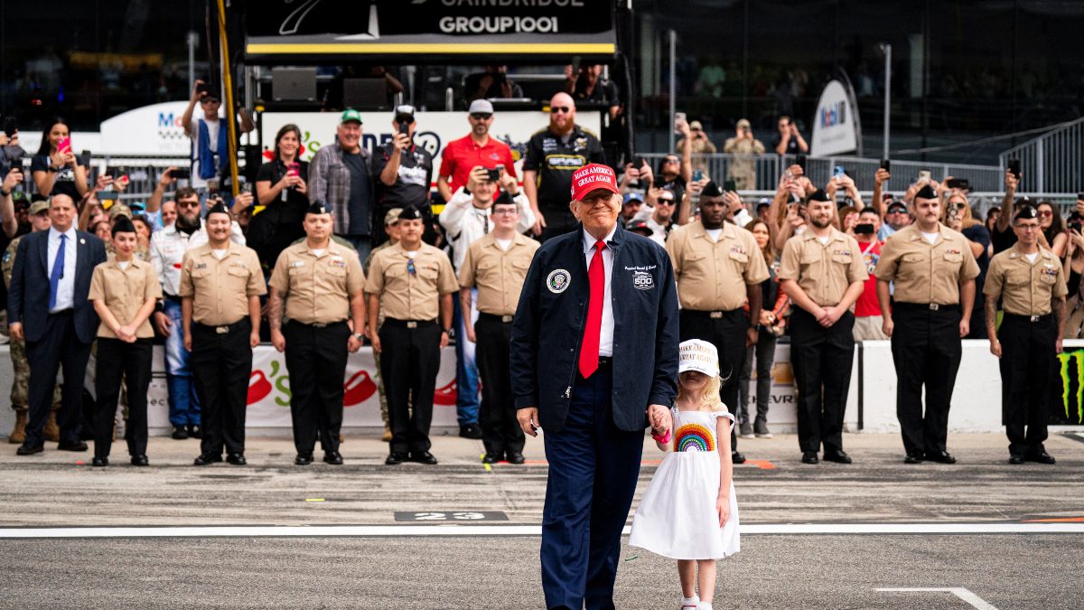 Donald Trump with his granddaughter at Daytona 500. Image: Reuters Donald Trump with his granddaughter at Daytona 500. Image: Reuters