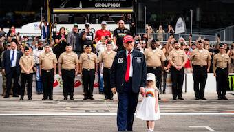 Donald Trump with his granddaughter at Daytona 500. Image: Reuters