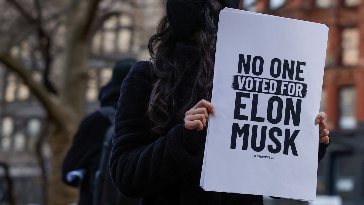 A protester holds a sign referencing Elon Musk, who is heading US President Donald Trump's drive to shrink the federal government, as demonstrators gather in protest of US President Donald Trump outside New York's City Hall, in New York City, US, February 5, 2025. File Image/Reuters A protester holds a sign referencing Elon Musk, who is heading US President Donald Trump's drive to shrink the federal government, as demonstrators gather in protest of US President Donald Trump outside New York's City Hall, in New York City, US, February 5, 2025. File Image/Reuters
