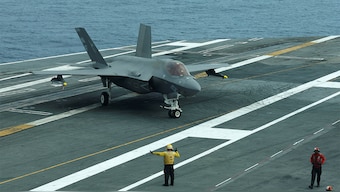 (File) A flight deck crew signal to F-35 jet on USS George Washington during Freedom Edge trilateral exercise among United States, Japan and South Korea in the East China Sea, south of the Korean peninsula and west of Japan's main islands November 14, 2024. Reuters