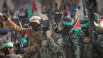 Hamas terrorists arrive in a pick-up truck to the site of the hand over of hostage Agam Beger to the Red Cross at the Jabalya refugee camp in Gaza City, Thursday Jan. 30, 2025. (Photo: AP)