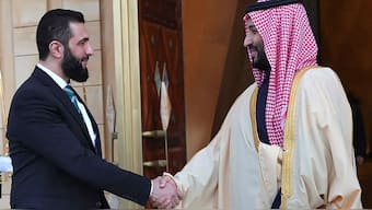 Saudi Arabia’s Crown Prince, Mohammed bin Salman, right, welcomes Syria's interim president, Ahmed al-Sharaa, on Sunday, February 2, 2025. (Photo: AFP)
