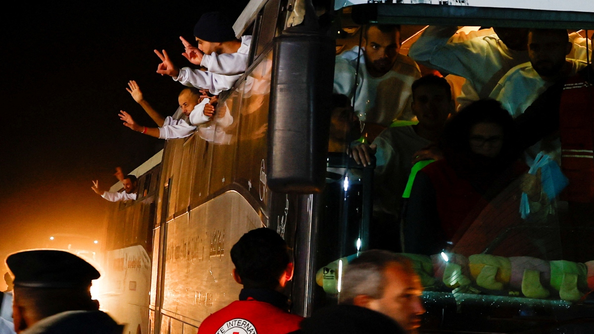 Freed Palestinian prisoners gesture out of the windows as they arrive in a bus after being released from an Israeli jail as part of a ceasefire and a hostages-prisoners swap deal between Hamas and Israel, in Khan Younis in the southern Gaza Strip, on Thursday. Reuters Freed Palestinian prisoners gesture out of the windows as they arrive in a bus after being released from an Israeli jail as part of a ceasefire and a hostages-prisoners swap deal between Hamas and Israel, in Khan Younis in the southern Gaza Strip, on Thursday. Reuters
