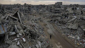 People walk amidst the destruction caused by the Israeli air and ground offensive in Rafah, southern Gaza Strip, February 24, 2025. File Image/AP