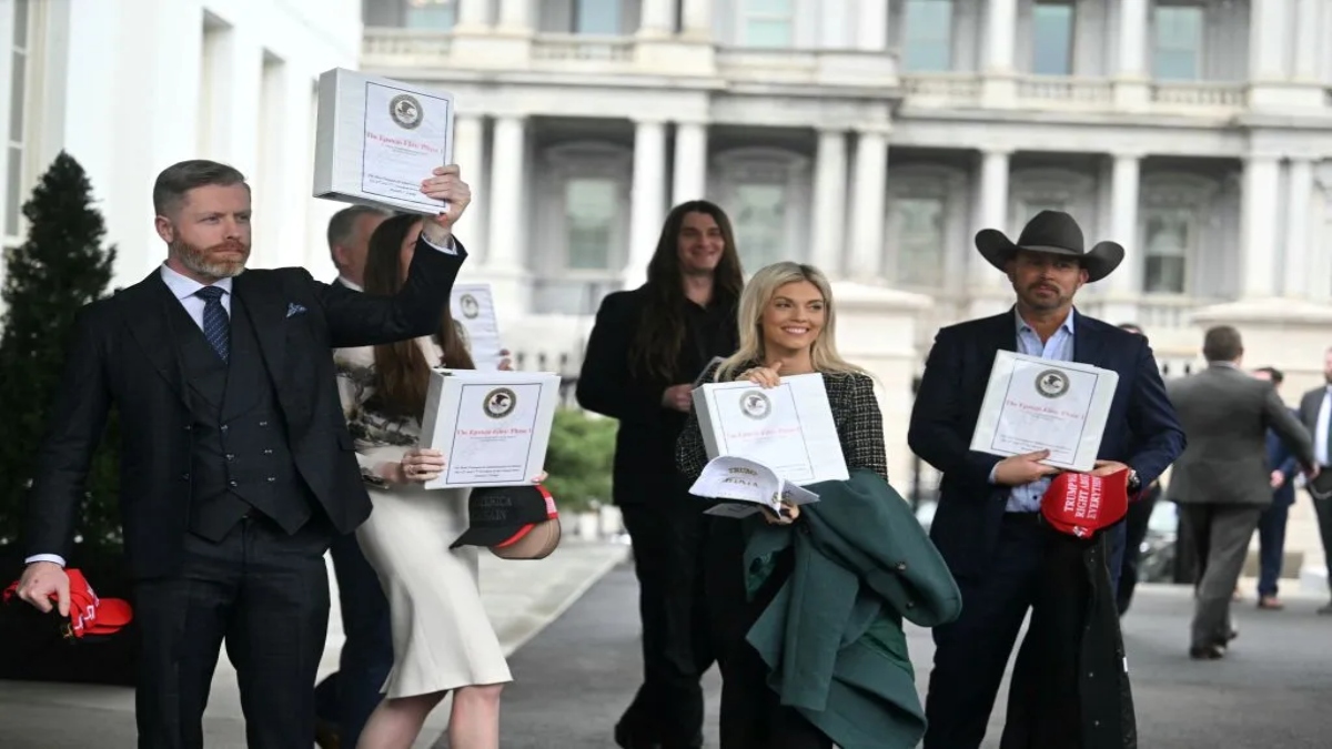 Political commentator Rogan O'Handley, a.k.a. DC Draino, and other unidentified people carrying binders bearing the seal of the U.S. Justice Department reading "The Epstein Files: Phase 1" walk out of the West Wing of the White House on Feb. 27, 2025. AFP Political commentator Rogan O'Handley, a.k.a. DC Draino, and other unidentified people carrying binders bearing the seal of the U.S. Justice Department reading "The Epstein Files: Phase 1" walk out of the West Wing of the White House on Feb. 27, 2025. AFP