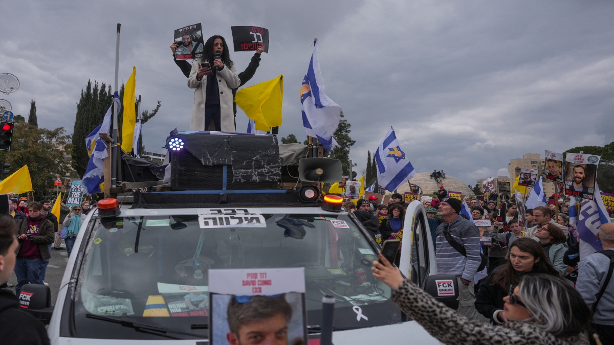 Relatives and supporters of hostages held by Hamas in the Gaza Strip protest outside the prime minister's office in Jerusalem on Tuesday, after Hamas announced it would delay a planned hostage release after accusing Israel of violating a fragile ceasefire. AP Relatives and supporters of hostages held by Hamas in the Gaza Strip protest outside the prime minister's office in Jerusalem on Tuesday, after Hamas announced it would delay a planned hostage release after accusing Israel of violating a fragile ceasefire. AP