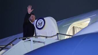 US Vice President JD Vance waves as he boards Air Force Two for travel back to Washington from Munich International Airport in Munich, Germany on February 14, 2025. Reuters