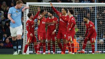 Liverpool players celebrate after star forward Mohamed Salah puts them in the lead in their away Premier League meeting with defending champions Manchester City. Reuters