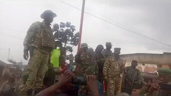 One of several people in military clothing speaks to a gathered crowd in Katana, near Kavumu airport, Democratic Republic of Congo, as Rwandan-backed M23 rebels have captured the town, according to an M23 source, a resident and a civil society leader, in this still image obtained from a social media video released on February 14, 2025. File image/ Reuters