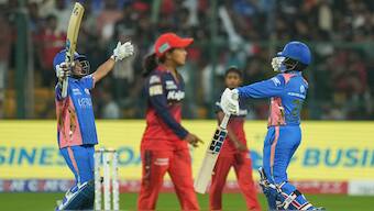 Mumbai Indians' Amanjot Kaur and G Kamalini celebrate after the latter struck the winning boundary, sealing a four-wicket victory over Royal Challengers Bengaluru with one ball to spare. PTI