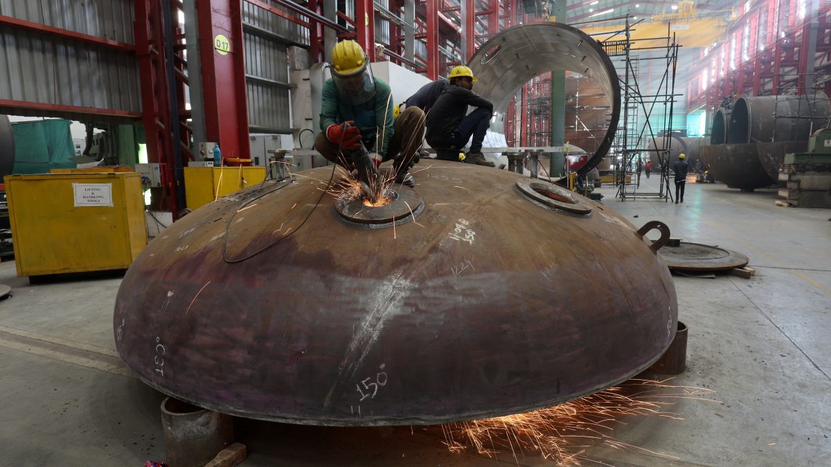 A worker grinds a surface of a metal pipe inside a industrial tank manufacturing factory on the outskirts of Ahmedabad, India. File image/ Reuters A worker grinds a surface of a metal pipe inside a industrial tank manufacturing factory on the outskirts of Ahmedabad, India. File image/ Reuters