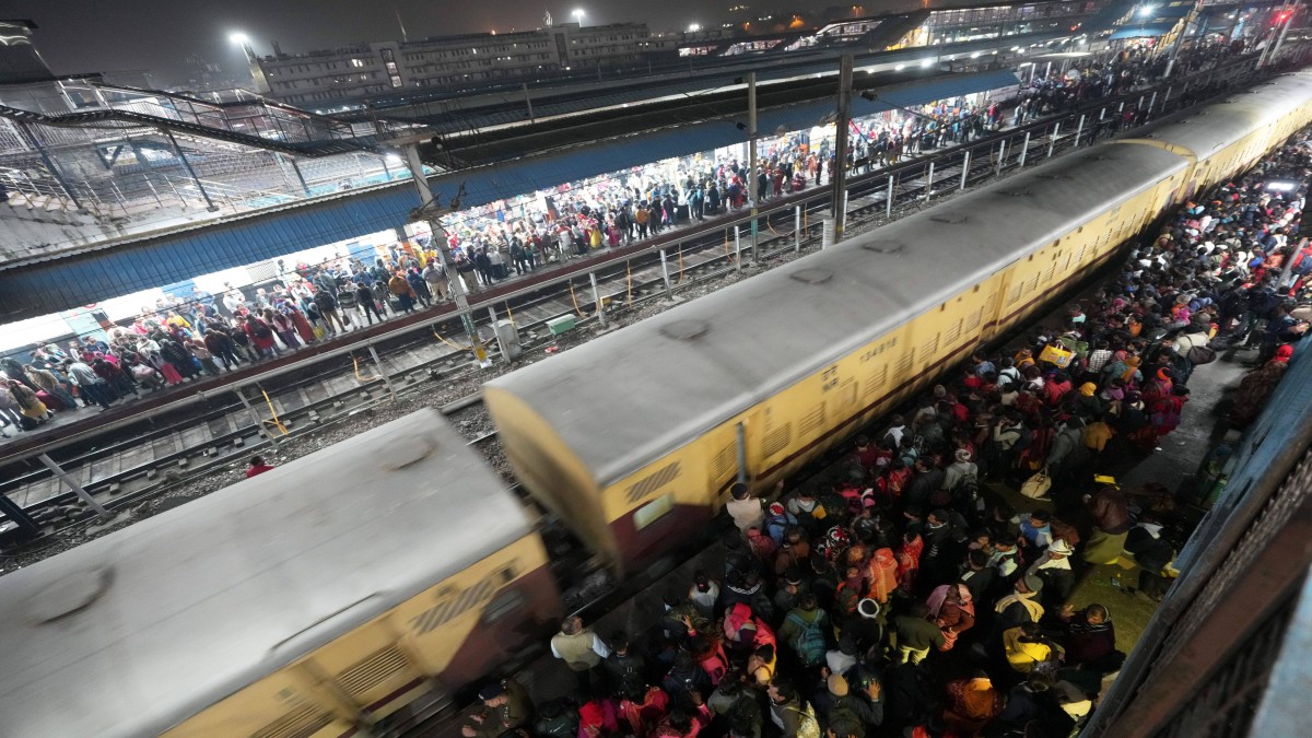 Heavy rush of passengers to catch a train for Mahakumbh, at the New Delhi railway station, Saturday, February 15, 2025. PTI Heavy rush of passengers to catch a train for Mahakumbh, at the New Delhi railway station, Saturday, February 15, 2025. PTI
