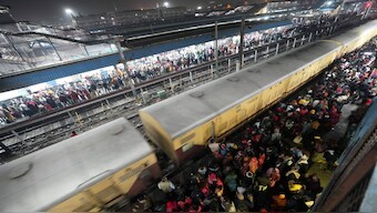 Heavy rush of passengers to catch a train for Mahakumbh, at the New Delhi railway station, Saturday, February 15, 2025. PTI