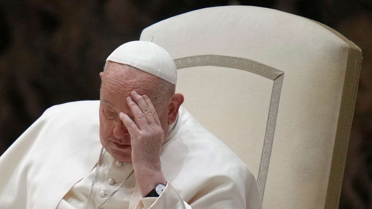 Pope Francis touches his forehead during his weekly general audience in the Paul VI Hall, at the Vatican. He is currently hospitalised after suffering a complex infection in his respiratory system. File image/AP Pope Francis touches his forehead during his weekly general audience in the Paul VI Hall, at the Vatican. He is currently hospitalised after suffering a complex infection in his respiratory system. File image/AP