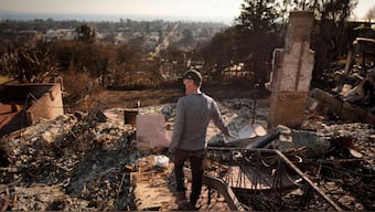 Tim Bearer walks in the rubble of his mother's fire-ravaged property in the aftermath of the Palisades Fire in the Pacific Palisades neighborhood of Los Angeles, Tuesday, Jan. 28, 2025. Image- AP