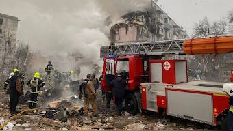 In this photo provided by the Ukrainian Emergency Service, firefighters put out the fire in the ruined apartment building following a Russian rocket attack in Poltava, Ukraine, Saturday, Feb. 1, 2025. (Ukrainian Emergency Service via AP)

