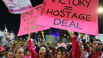 Demonstrators raise placards during a protest calling for the release of hostages held captive in Gaza since the October 7, 2024 attack by Palestinian militants, in front of the Israeli Defence Ministry in Tel Aviv on February 1, 2025. Image- AFP