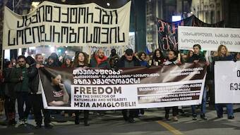 Protesters hold banners calling for the release of jailed journalist Mzia Amaghlobeli as they march through the streets in Tbilisi, Georgia, on Wednesday, Jan. 29, 2025.  Image- AP