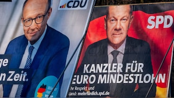 Election posters showing German Chancellor Olaf Scholz, right, and CDU top candidate for chancellor Friedrich Merz in Frankfurt, Germany, Feb. 8, 2025. File Image- AP