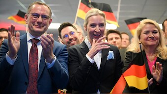 Co-leader of Germany's far-right Alternative for Germany (AfD) party and her party's top candidate for Chancellor Alice Weidel and co-leader of the far-right Alternative for Germany (AfD) party Tino Chrupalla cheer with party members during the electoral evening in Berlin on February 23, 2025, after the first exit polls in the German general elections. Image- AFP