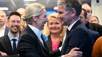 Co-leader of Germany's far-right Alternative for Germany (AfD) party and her party's top candidate for Chancellor Alice Weidel and regional chairman in Thuringia of the far-right Alternative for Germany (AfD) party Bjoern Hoecke (R) hug during the electoral evening in Berlin on February 23, 2025, after the first exit polls in the German general elections. Image- AFP